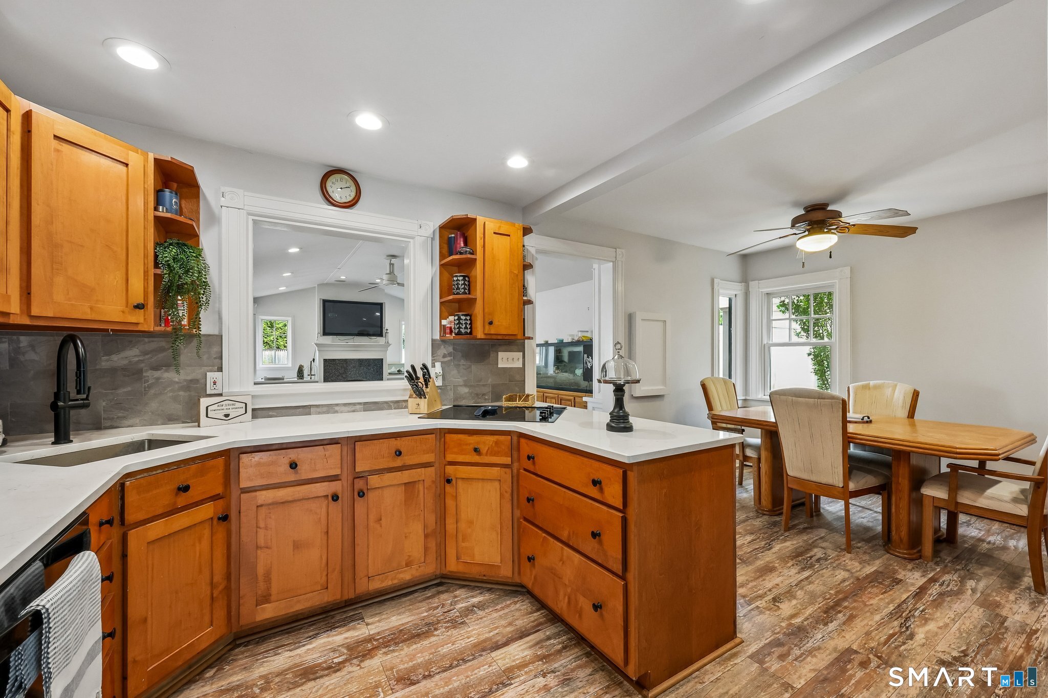 21 Friendly Road Norwalk, CT 06851 - Photo 5 of 28 White quartz countertops, new electric cooktop, new double-wall oven, new dishwasher, microwave and refrigerator add to the maintenance-free living in this Wolfpit home.