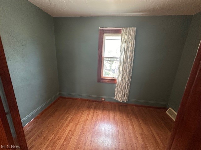 3231 Riverside Avenue Cleveland, OH 44109 - Photo 6 of 37 Empty room with hardwood / wood-style flooring