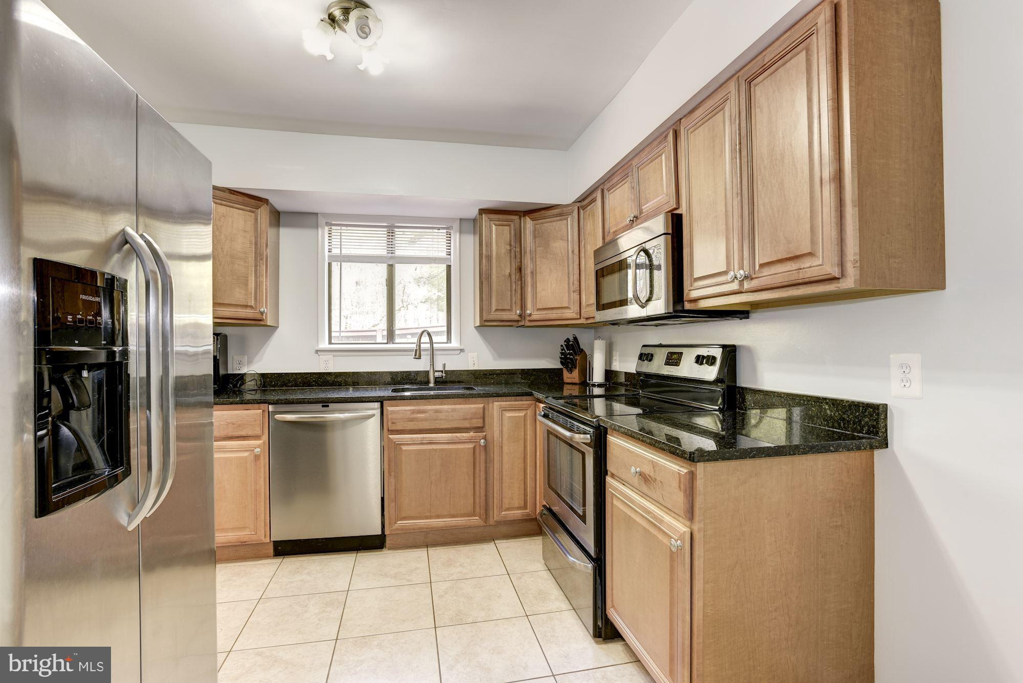 2454 Cloudcroft Square Reston, VA 20191 - Photo 7 of 29 Kitchen with maple cabinetry
