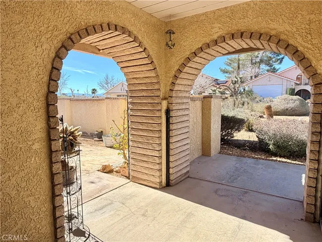 a view of swimming pool with outdoor seating and city view