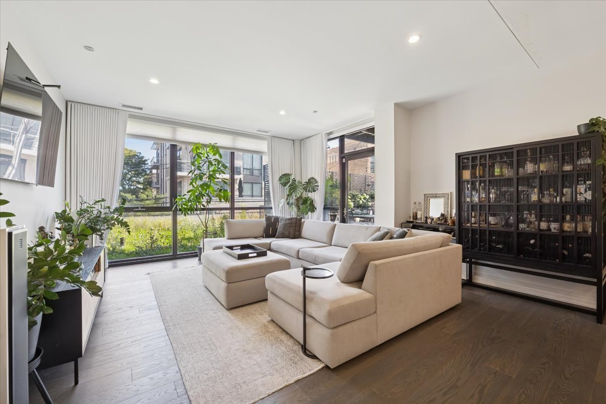 1648 West Division Street, Unit 208 Chicago, IL 60622 - Photo 14 of 48 a living room with furniture and a floor to ceiling window