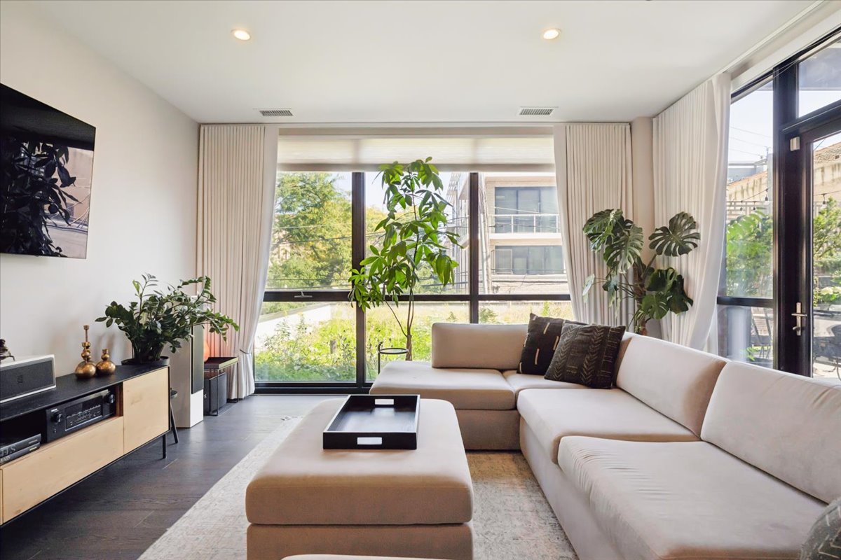 1648 West Division Street, Unit 208 Chicago, IL 60622 - Photo 16 of 48 a living room with furniture and a large window