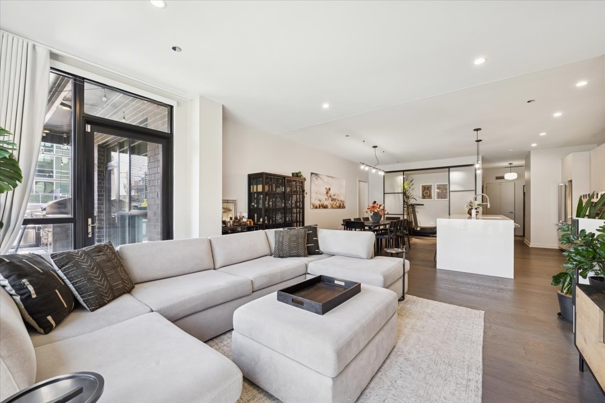 1648 West Division Street, Unit 208 Chicago, IL 60622 - Photo 17 of 48 a living room with furniture and a large window