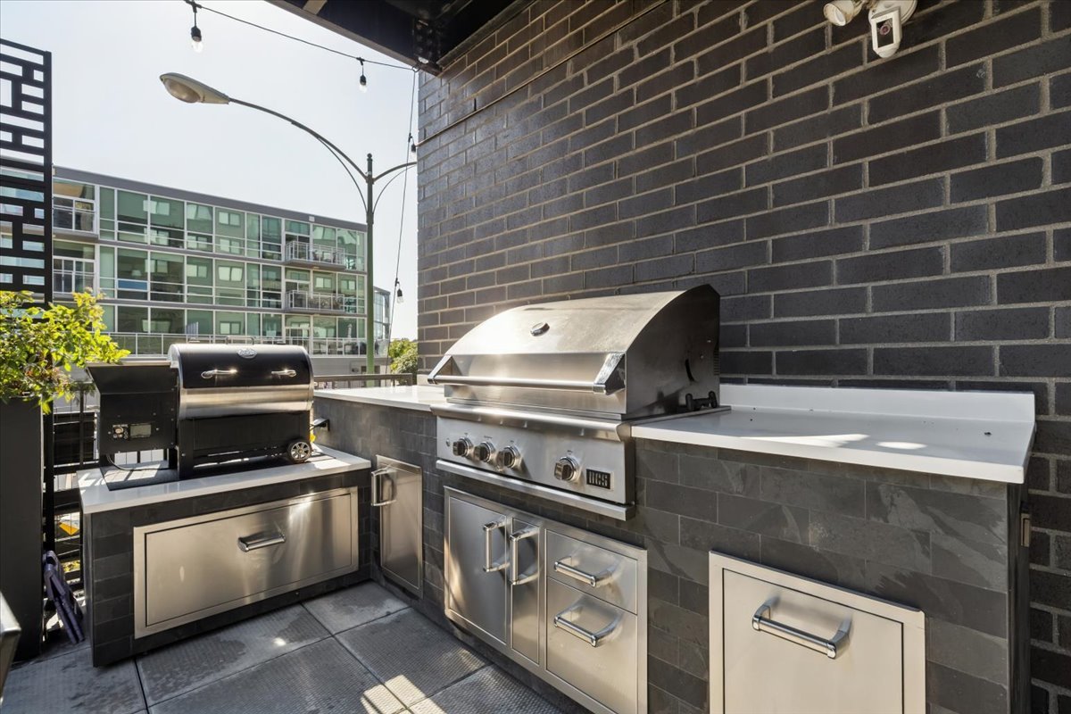 1648 West Division Street, Unit 208 Chicago, IL 60622 - Photo 22 of 48 a kitchen with a stove and a microwave