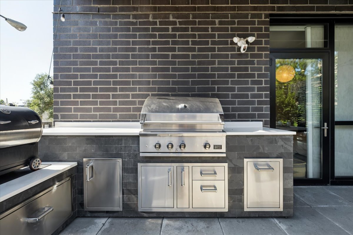 1648 West Division Street, Unit 208 Chicago, IL 60622 - Photo 23 of 48 a stove top oven sitting inside of a kitchen