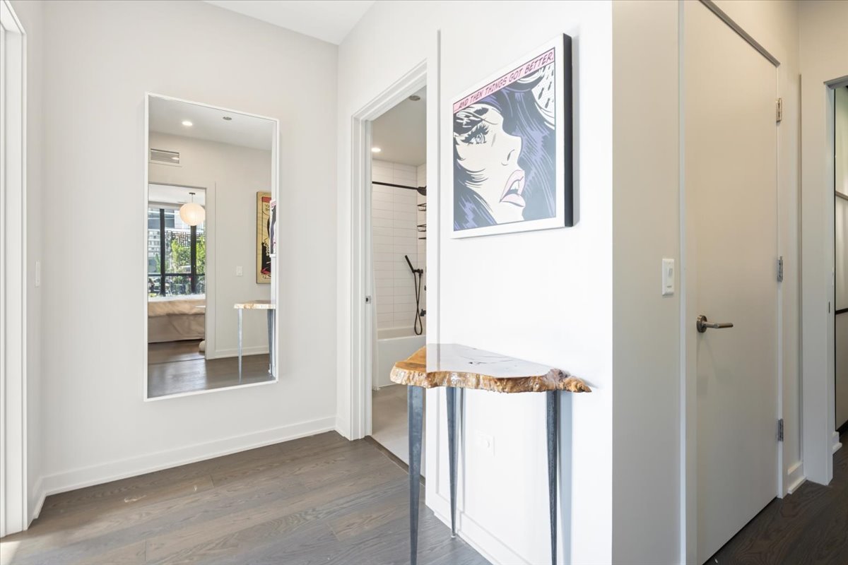 1648 West Division Street, Unit 208 Chicago, IL 60622 - Photo 25 of 48 a view of a hallway with wooden floor and entryway