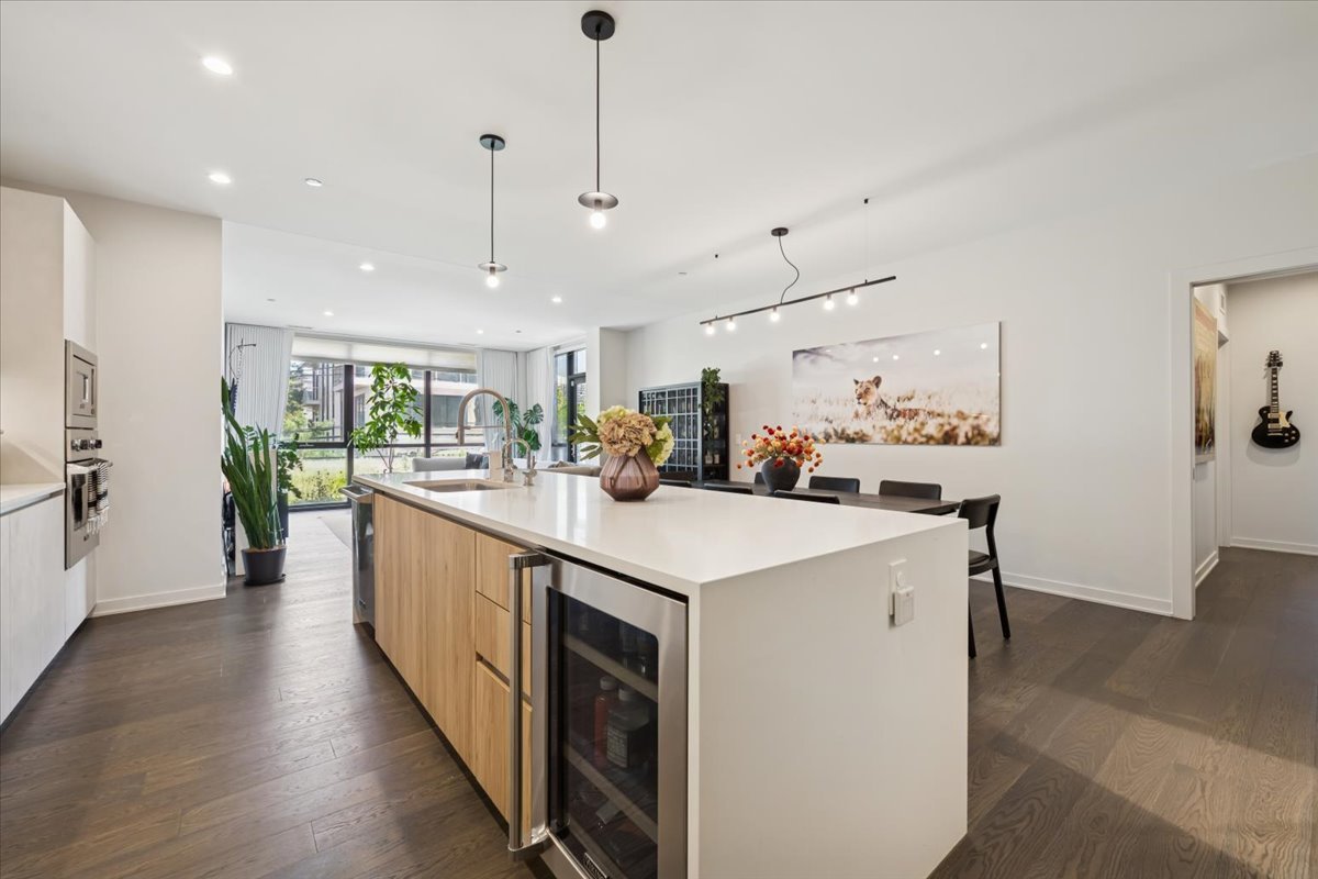 1648 West Division Street, Unit 208 Chicago, IL 60622 - Photo 3 of 48 a large white kitchen with lots of counter space and stainless steel appliances