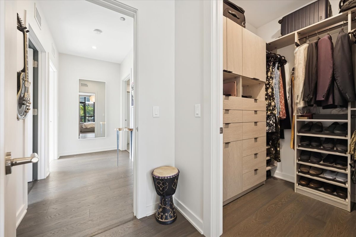 1648 West Division Street, Unit 208 Chicago, IL 60622 - Photo 31 of 48 a view of walk in closet with clothes and shoes