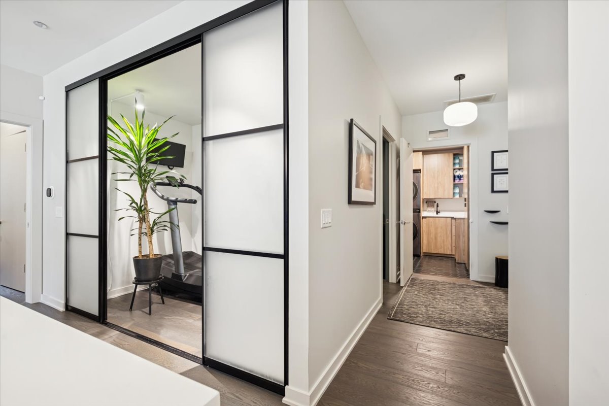 1648 West Division Street, Unit 208 Chicago, IL 60622 - Photo 35 of 48 a view of a hallway with closet and a potted plant