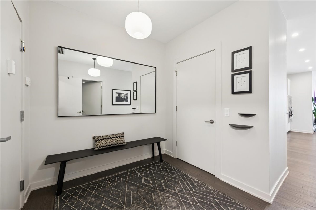 1648 West Division Street, Unit 208 Chicago, IL 60622 - Photo 39 of 48 a view of a hallway with wooden floor and a bathroom