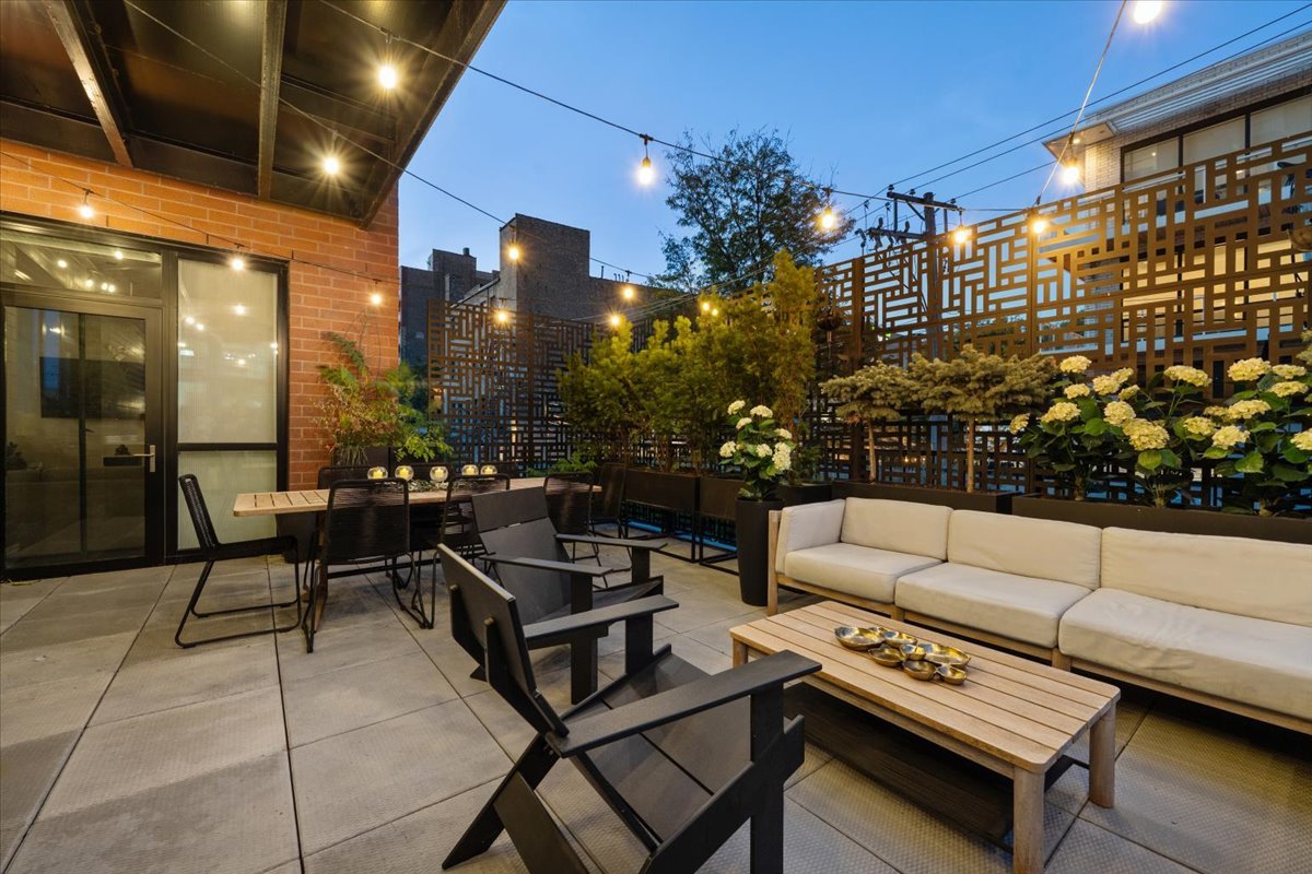 1648 West Division Street, Unit 208 Chicago, IL 60622 - Photo 45 of 48 a outdoor living space with furniture and a potted plant
