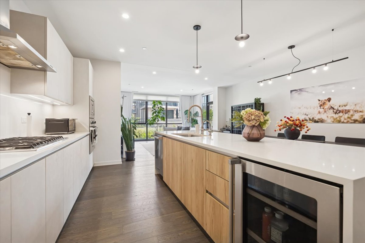 1648 West Division Street, Unit 208 Chicago, IL 60622 - Photo 5 of 48 a kitchen with stainless steel appliances sink stove top oven and cabinets