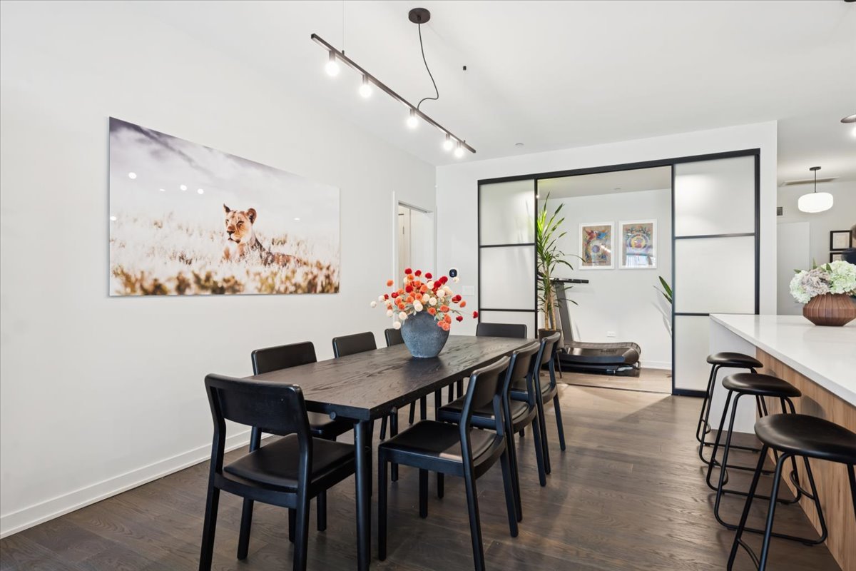 1648 West Division Street, Unit 208 Chicago, IL 60622 - Photo 8 of 48 a view of a dining room with furniture and wooden floor