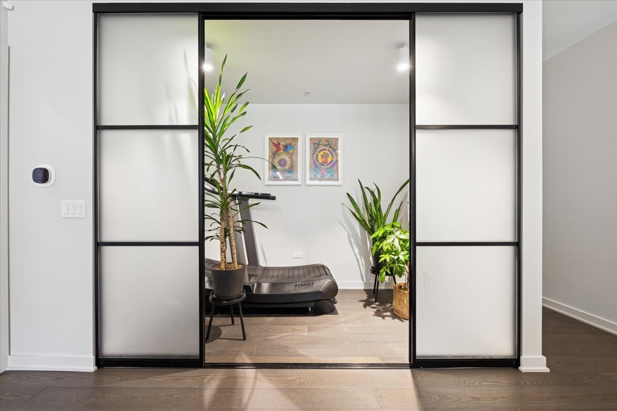 1648 West Division Street, Unit 208 Chicago, IL 60622 - Photo 9 of 48 a white refrigerator freezer sitting in a kitchen