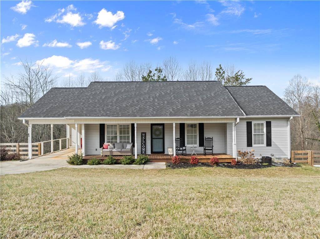 a front view of house with yard and outdoor seating