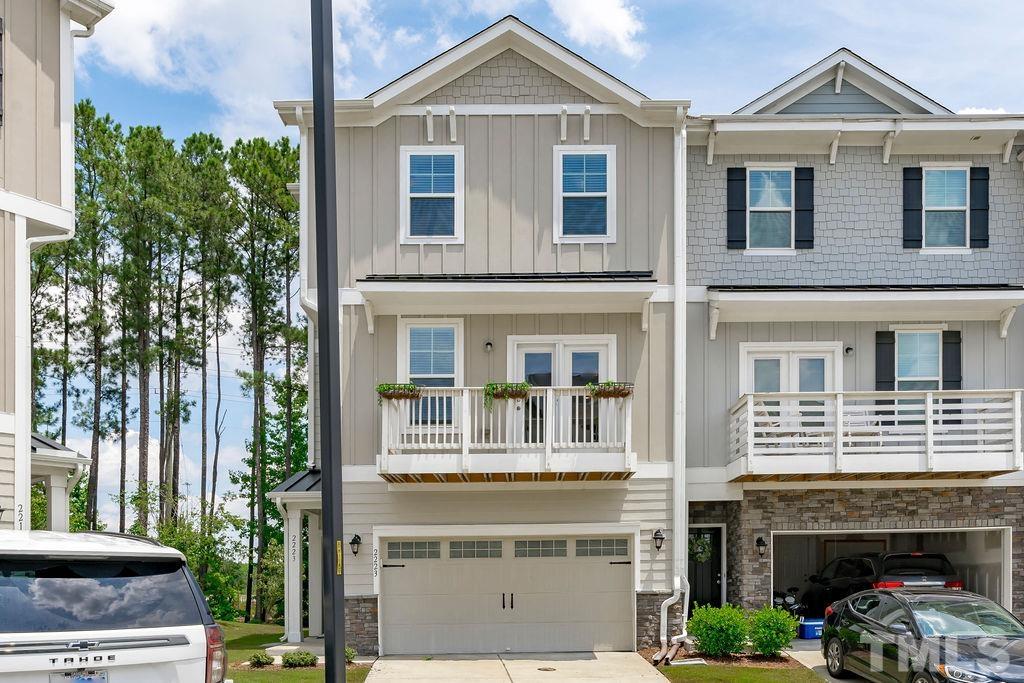 2223 Chattering Lory Lane Apex, NC 27502 - Photo 2 of 49 a front view of a house with a yard