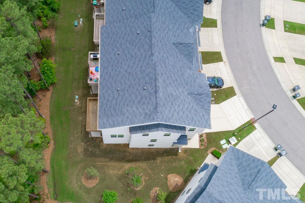 2223 Chattering Lory Lane Apex, NC 27502 - Photo 49 of 49 an aerial view of residential houses with outdoor space