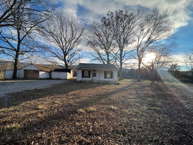 688 Spur Road Decherd, TN 37324 - Photo 1 of 15 a view of a yard with a house