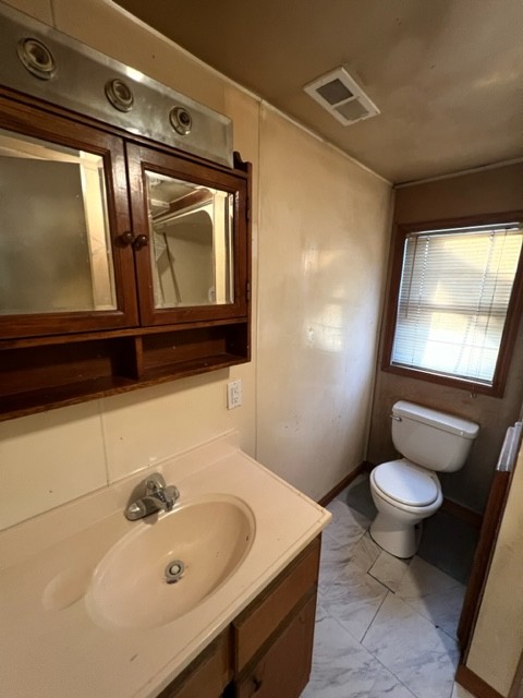 688 Spur Road Decherd, TN 37324 - Photo 11 of 15 a bathroom with a sink toilet and mirror