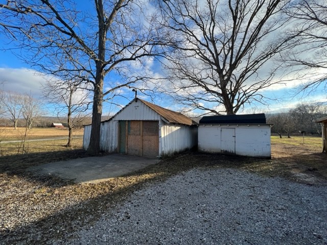 688 Spur Road Decherd, TN 37324 - Photo 3 of 15 a view of a house with a large tree