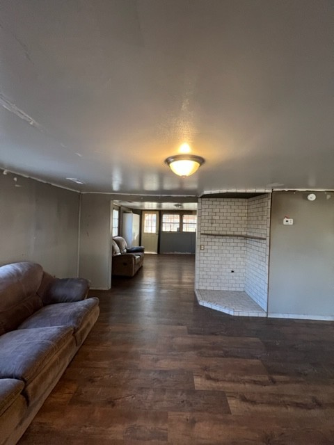 688 Spur Road Decherd, TN 37324 - Photo 7 of 15 a living room with furniture and a wooden floor