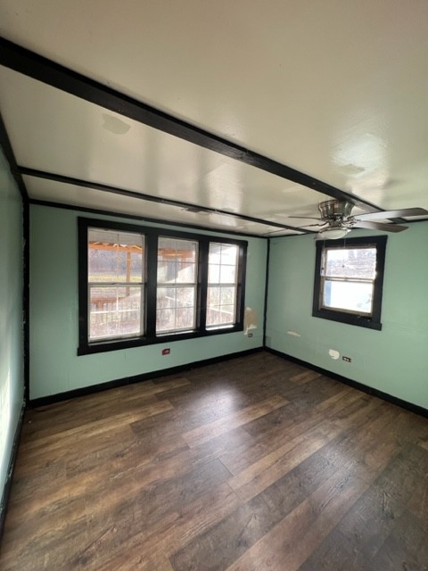 688 Spur Road Decherd, TN 37324 - Photo 10 of 15 an empty room with wooden floor and windows