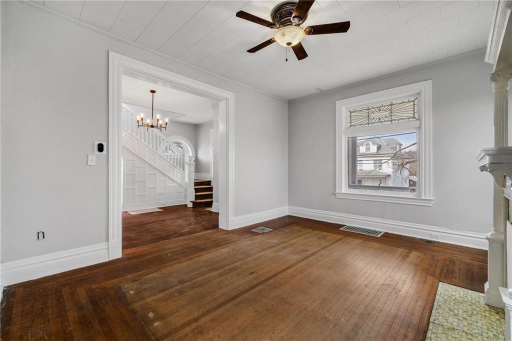 1630 State Avenue Coraopolis, PA 15108 - Photo 11 of 47 a view of empty room with wooden floor and fan