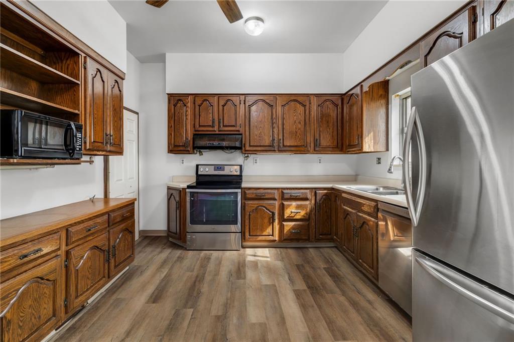 1630 State Avenue Coraopolis, PA 15108 - Photo 16 of 47 a kitchen with stainless steel appliances granite countertop a refrigerator a stove top oven a sink and dishwasher