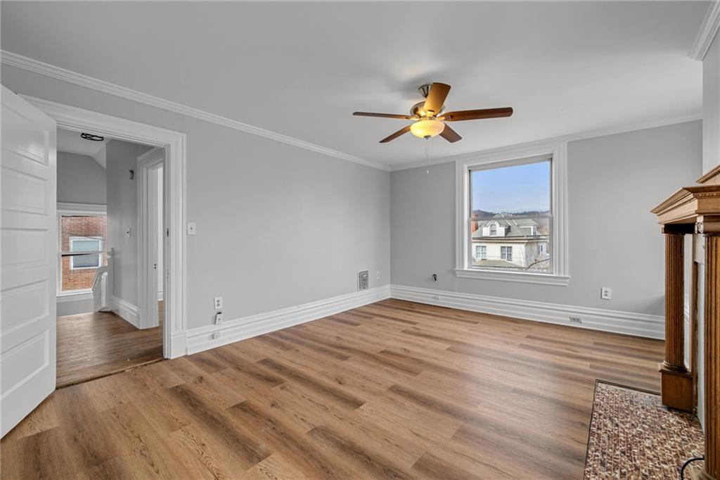 1630 State Avenue Coraopolis, PA 15108 - Photo 22 of 47 a view of empty room with wooden floor and fan