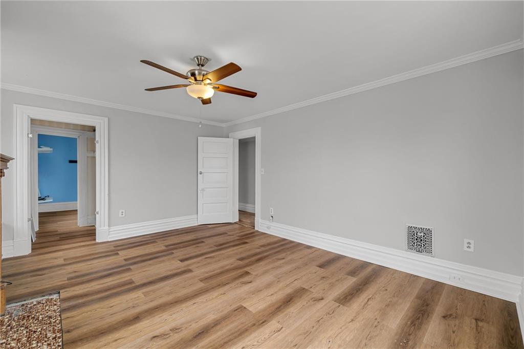 1630 State Avenue Coraopolis, PA 15108 - Photo 23 of 47 a view of empty room with wooden floor and fan