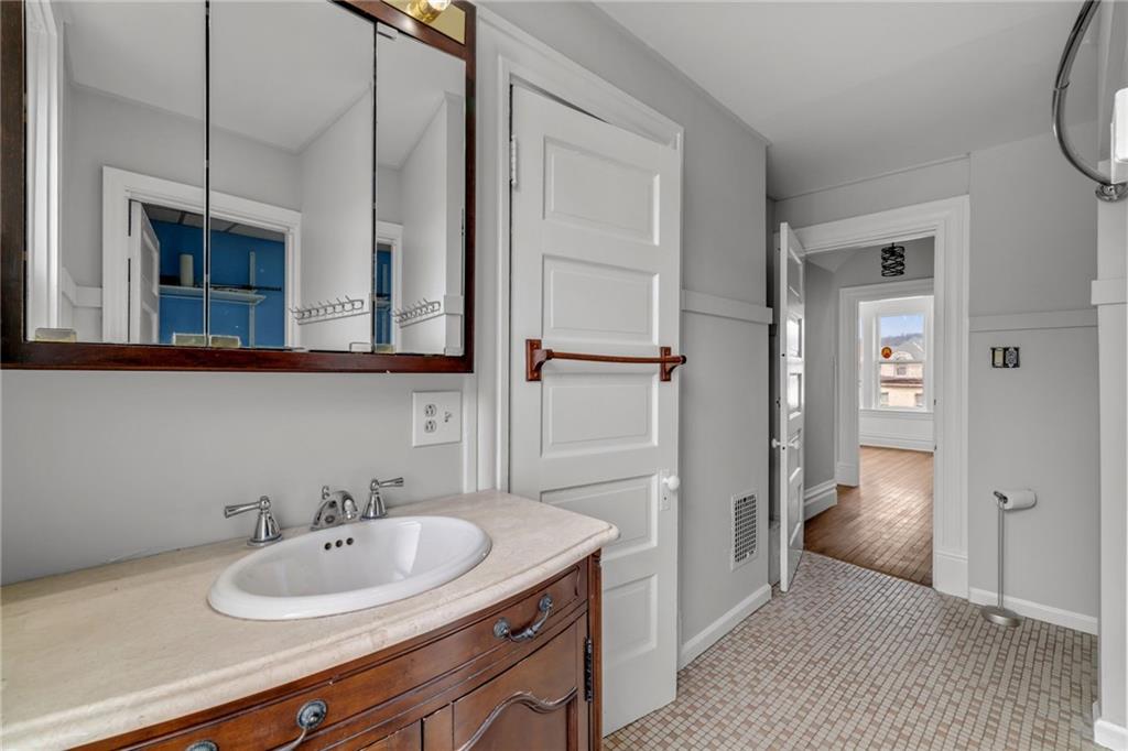 1630 State Avenue Coraopolis, PA 15108 - Photo 26 of 47 a bathroom with a sink and a mirror