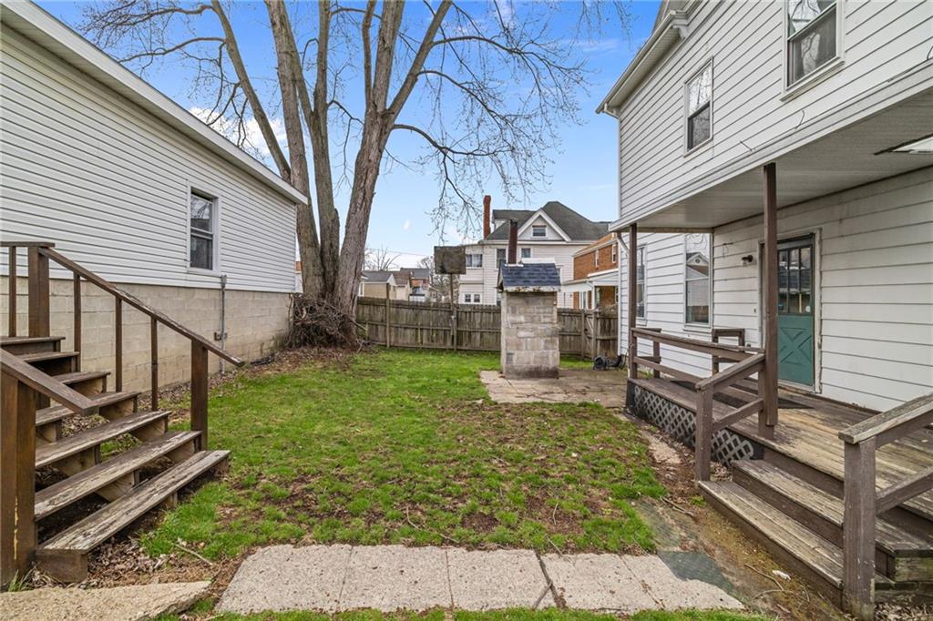 1630 State Avenue Coraopolis, PA 15108 - Photo 40 of 47 a view of a house with backyard and wooden fence