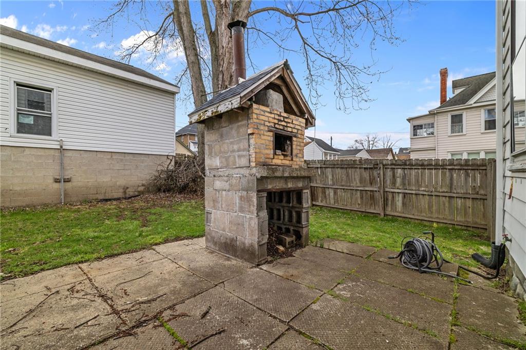 1630 State Avenue Coraopolis, PA 15108 - Photo 41 of 47 a view of backyard with wooden fence and a large tree