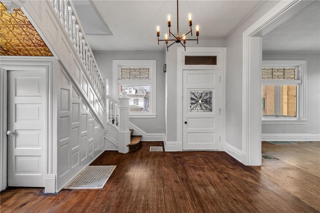 1630 State Avenue Coraopolis, PA 15108 - Photo 8 of 47 a view of entryway with wooden floor and stair