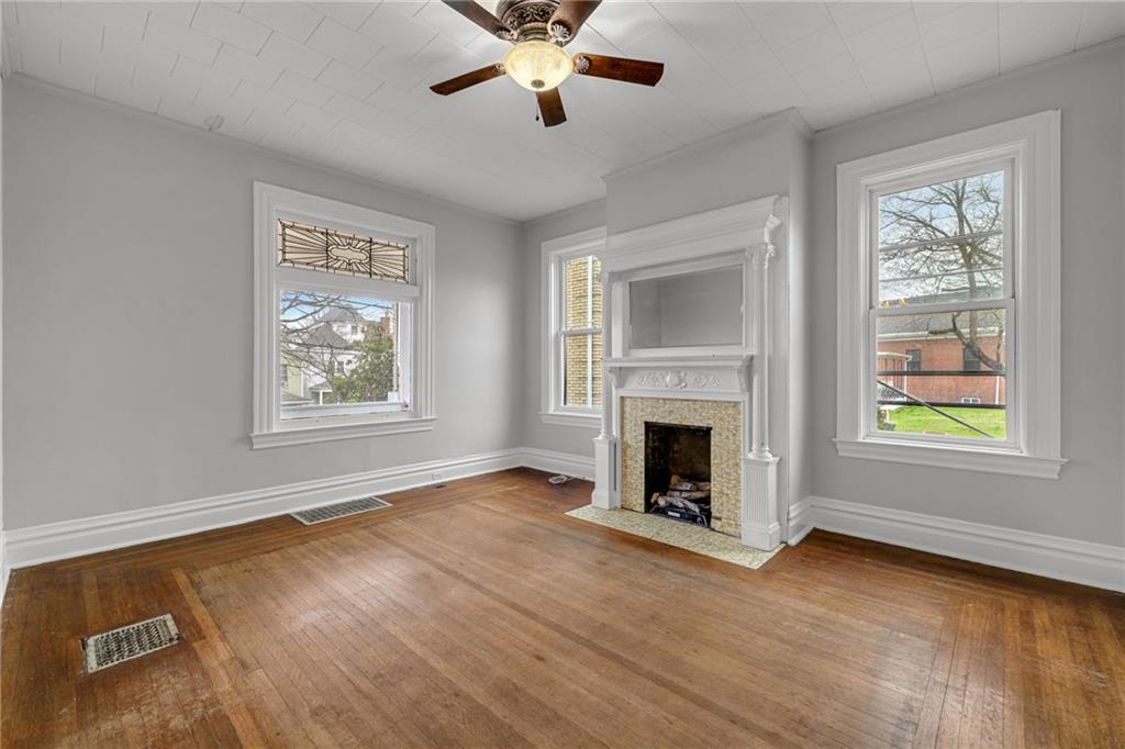 1630 State Avenue Coraopolis, PA 15108 - Photo 10 of 47 a view of an empty room with window and fire place