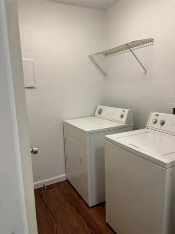 a view of small house with backyard