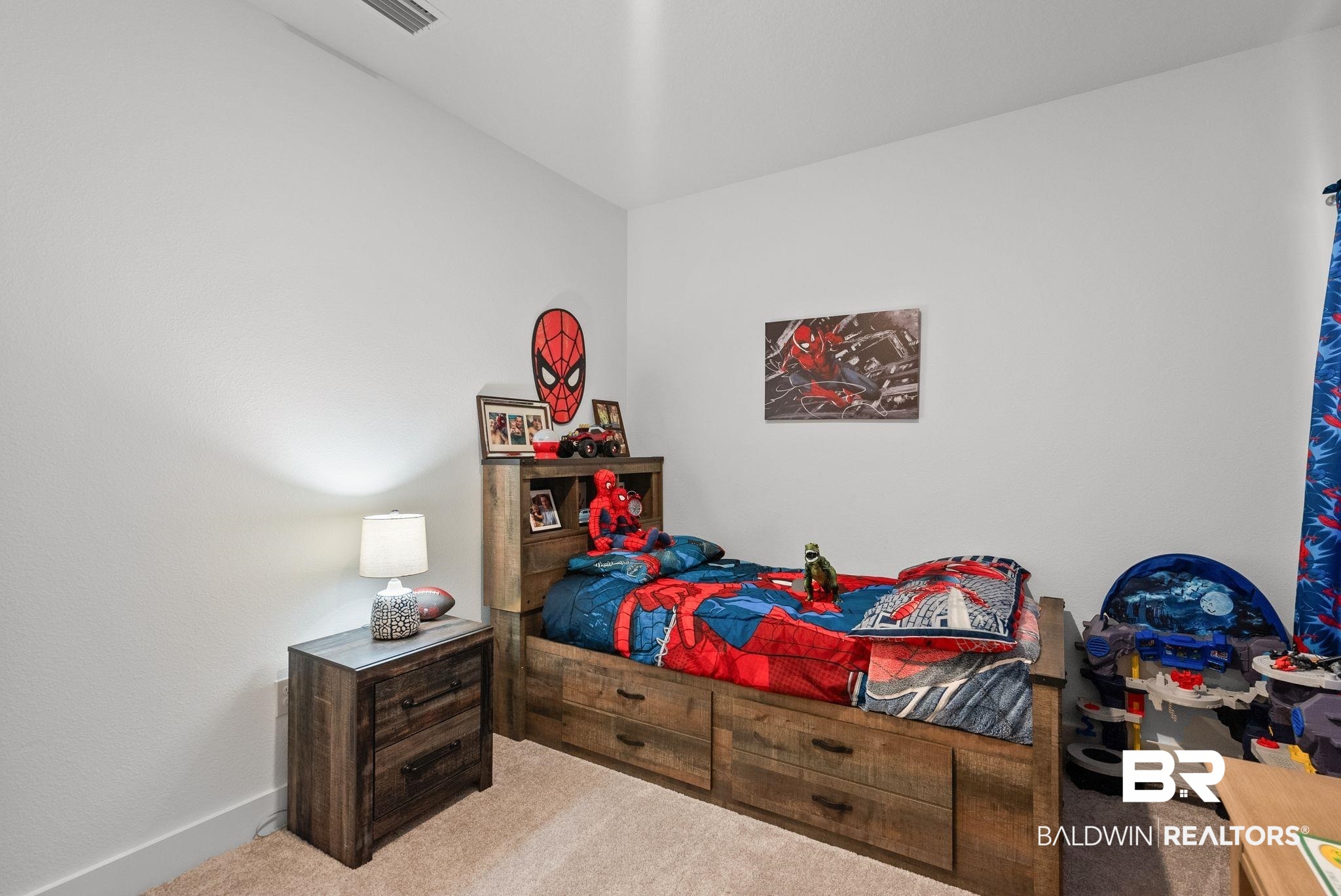 9899 Willet Way Foley, AL 36535 - Photo 25 of 37 Carpeted room with light-colored walls and a recessed ceiling vent