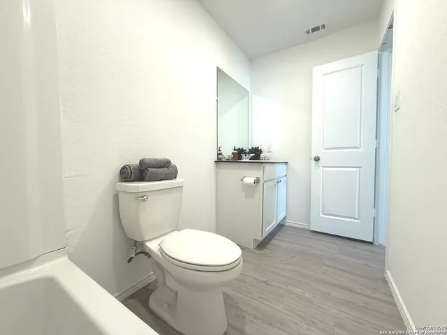 a view of a swimming pool and lounge chairs