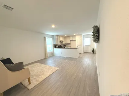 a view of kitchen and wooden floor