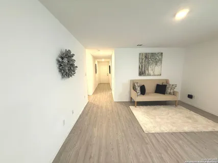 a living room with furniture and a rug