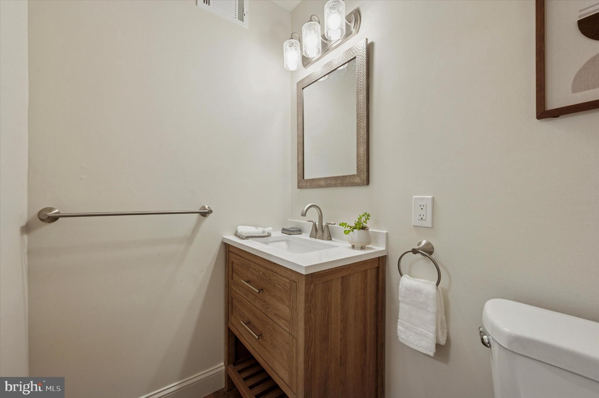 210 David Drive Havertown, PA 19083 - Photo 15 of 38 a bathroom with a toilet sink vanity and mirror