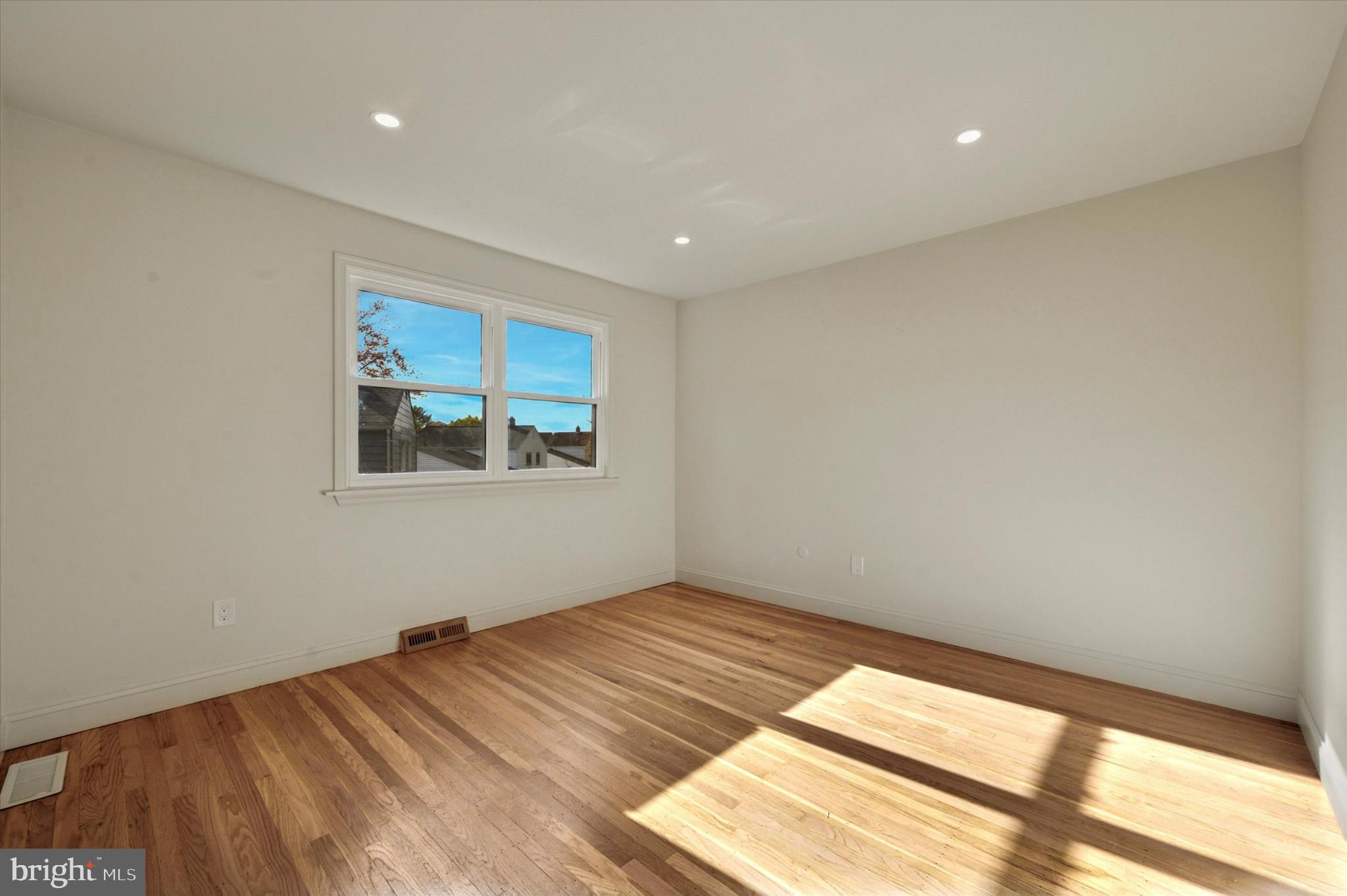 210 David Drive Havertown, PA 19083 - Photo 20 of 38 a view of empty room with wooden floor and fan