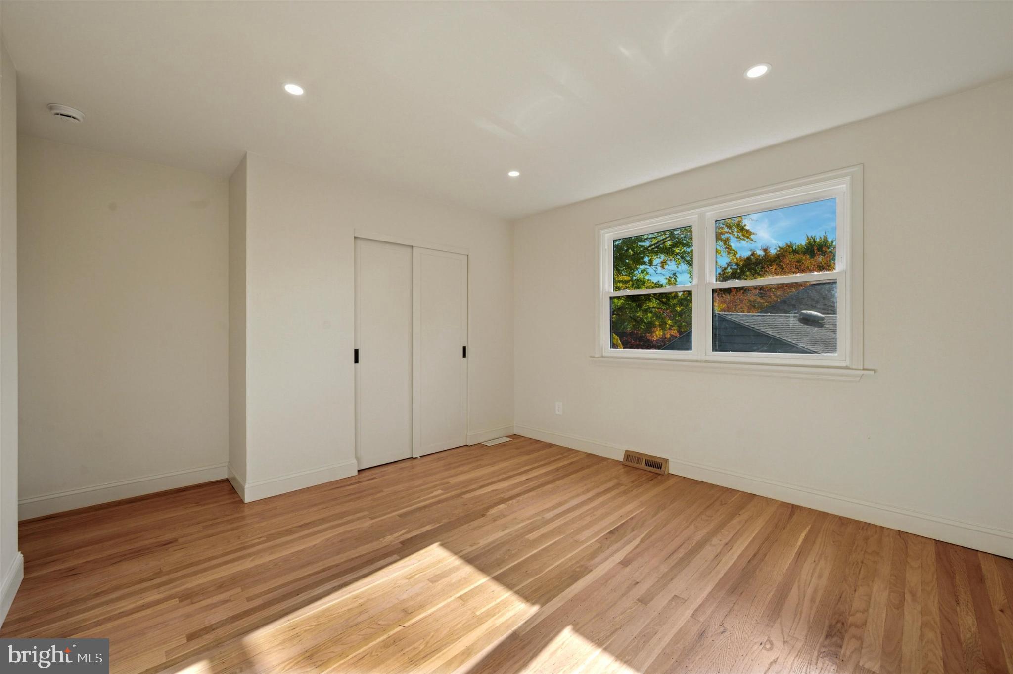 210 David Drive Havertown, PA 19083 - Photo 21 of 38 a view of empty room with wooden floor and fan
