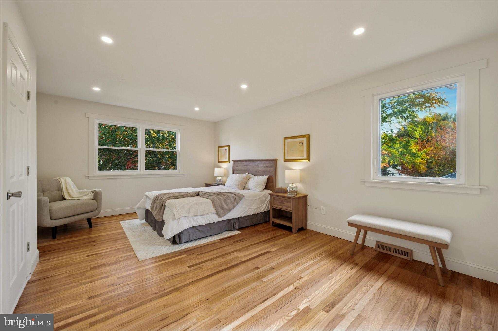 210 David Drive Havertown, PA 19083 - Photo 22 of 38 a spacious bedroom with a bed a couch and a window