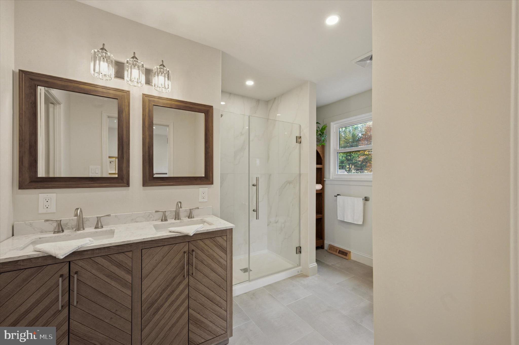 210 David Drive Havertown, PA 19083 - Photo 24 of 38 a en suite bathroom with a sink and a mirror