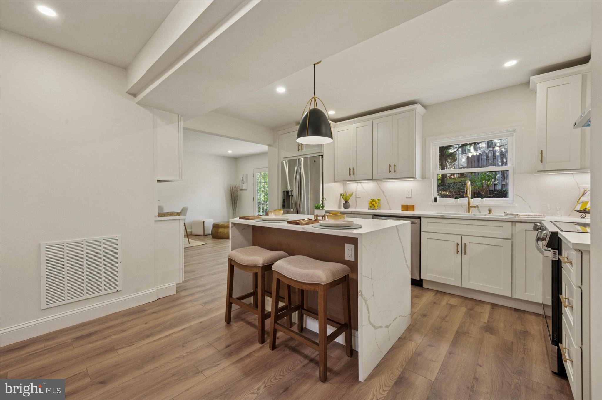 210 David Drive Havertown, PA 19083 - Photo 6 of 38 a kitchen with a sink cabinets and wooden floor