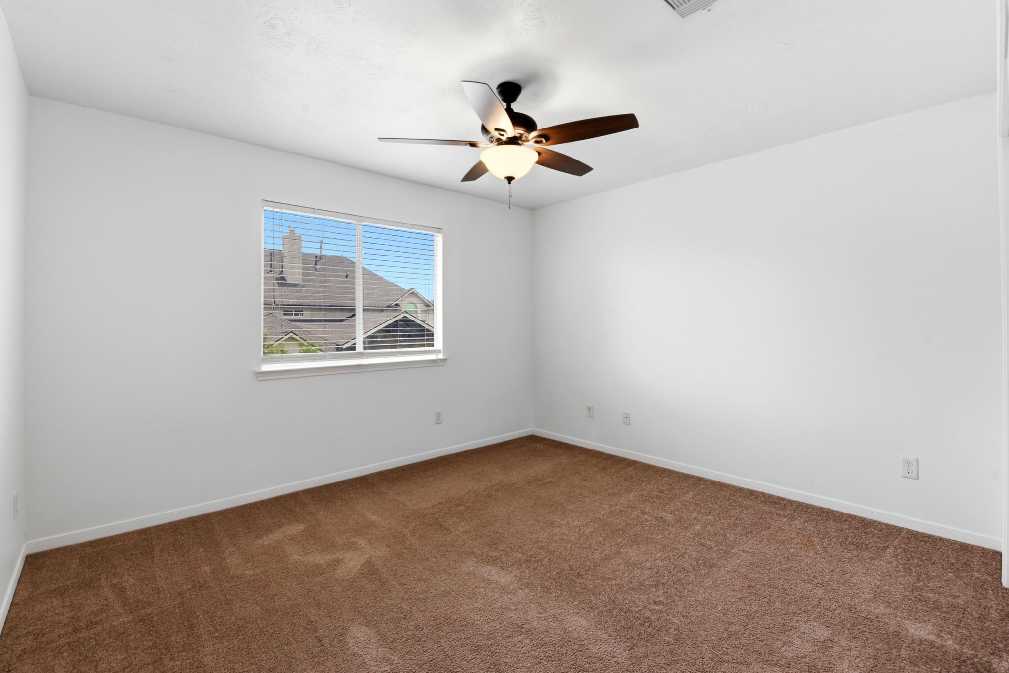 22102 Bridgestone Crossing Drive Spring, TX 77388 - Photo 26 of 38 an empty room with a window and a fan