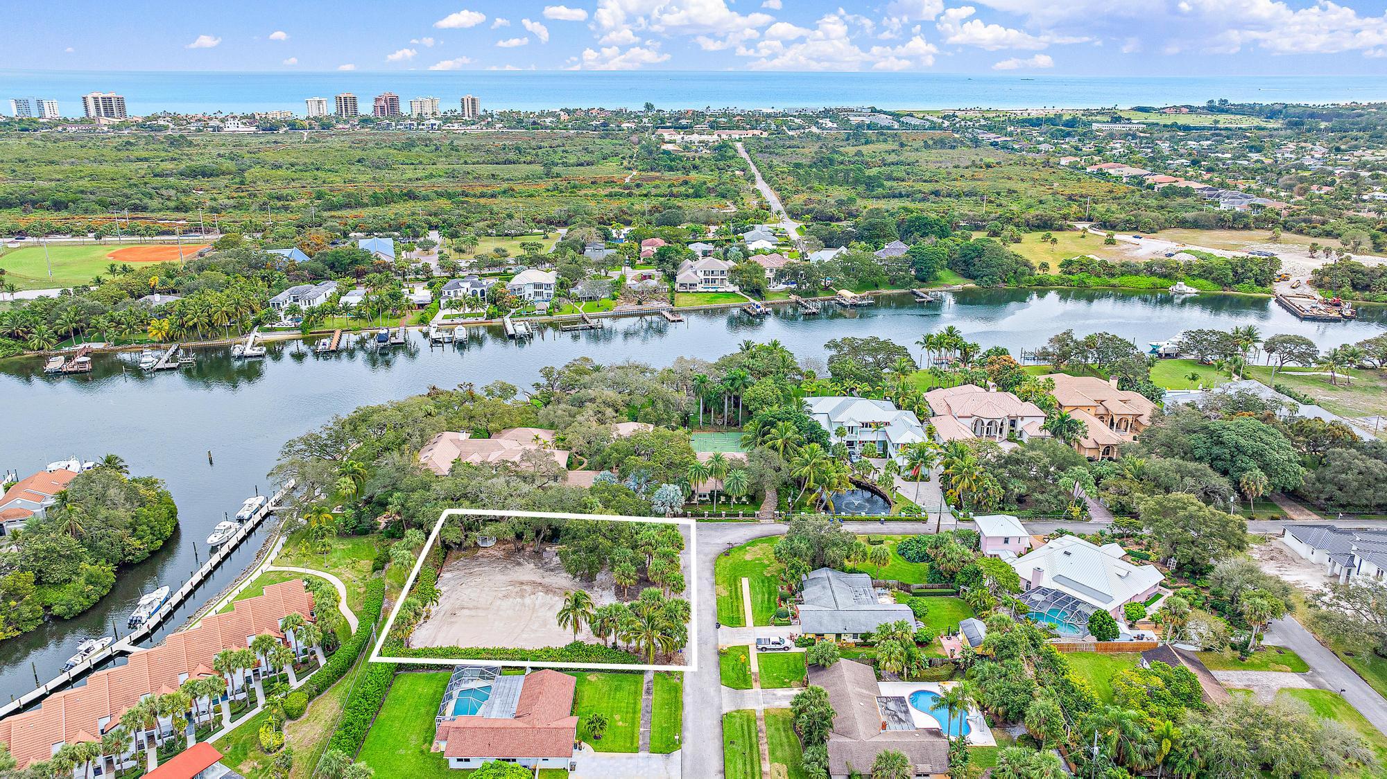 2267 Windsor Road Palm Beach Gardens, FL 33410 - Photo 5 of 17 an aerial view of residential houses with outdoor space and lake view