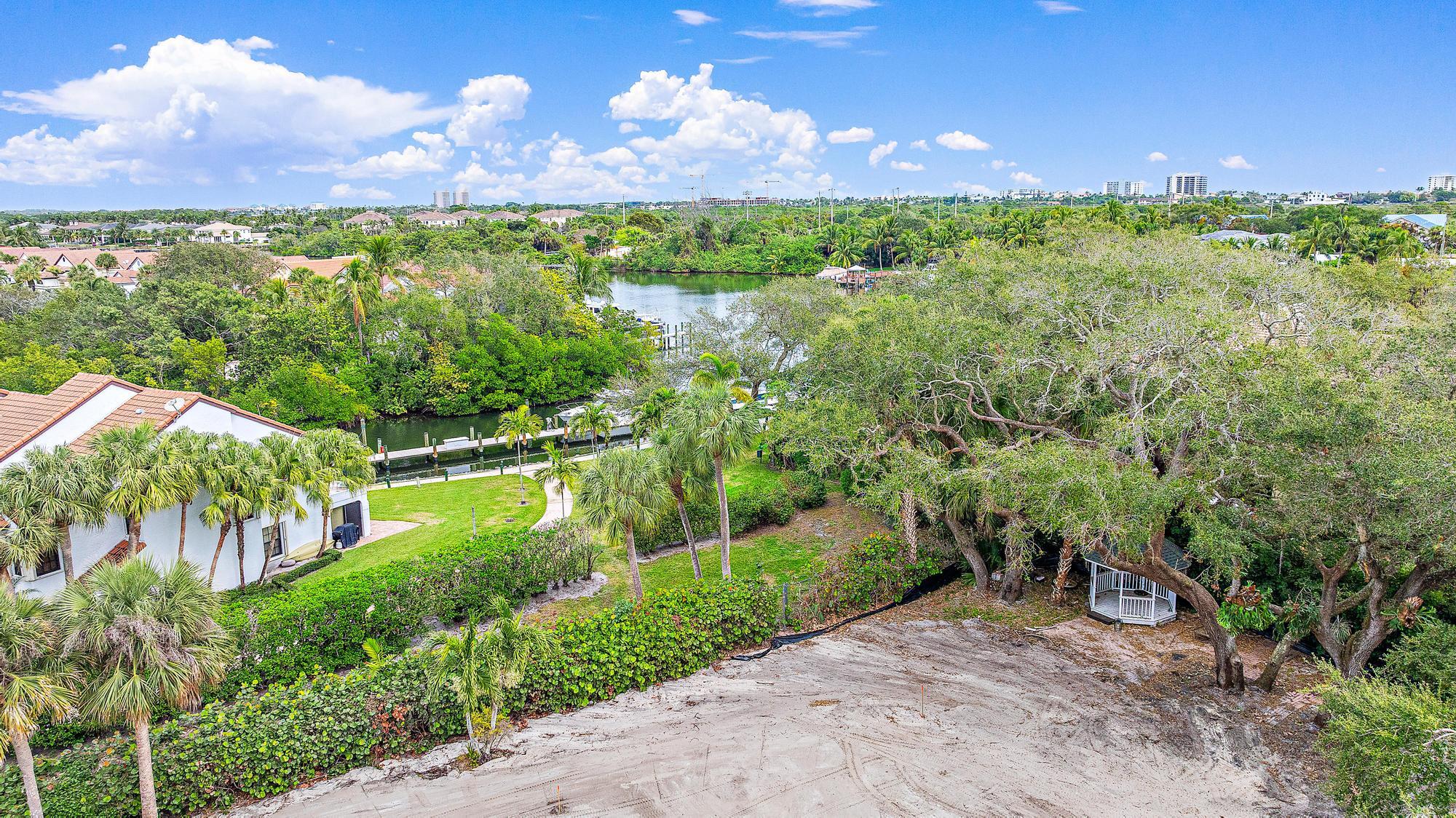 2267 Windsor Road Palm Beach Gardens, FL 33410 - Photo 9 of 17 a view of a lake with a yard