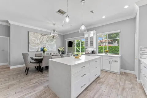 a kitchen with stainless steel appliances a refrigerator stove and microwave